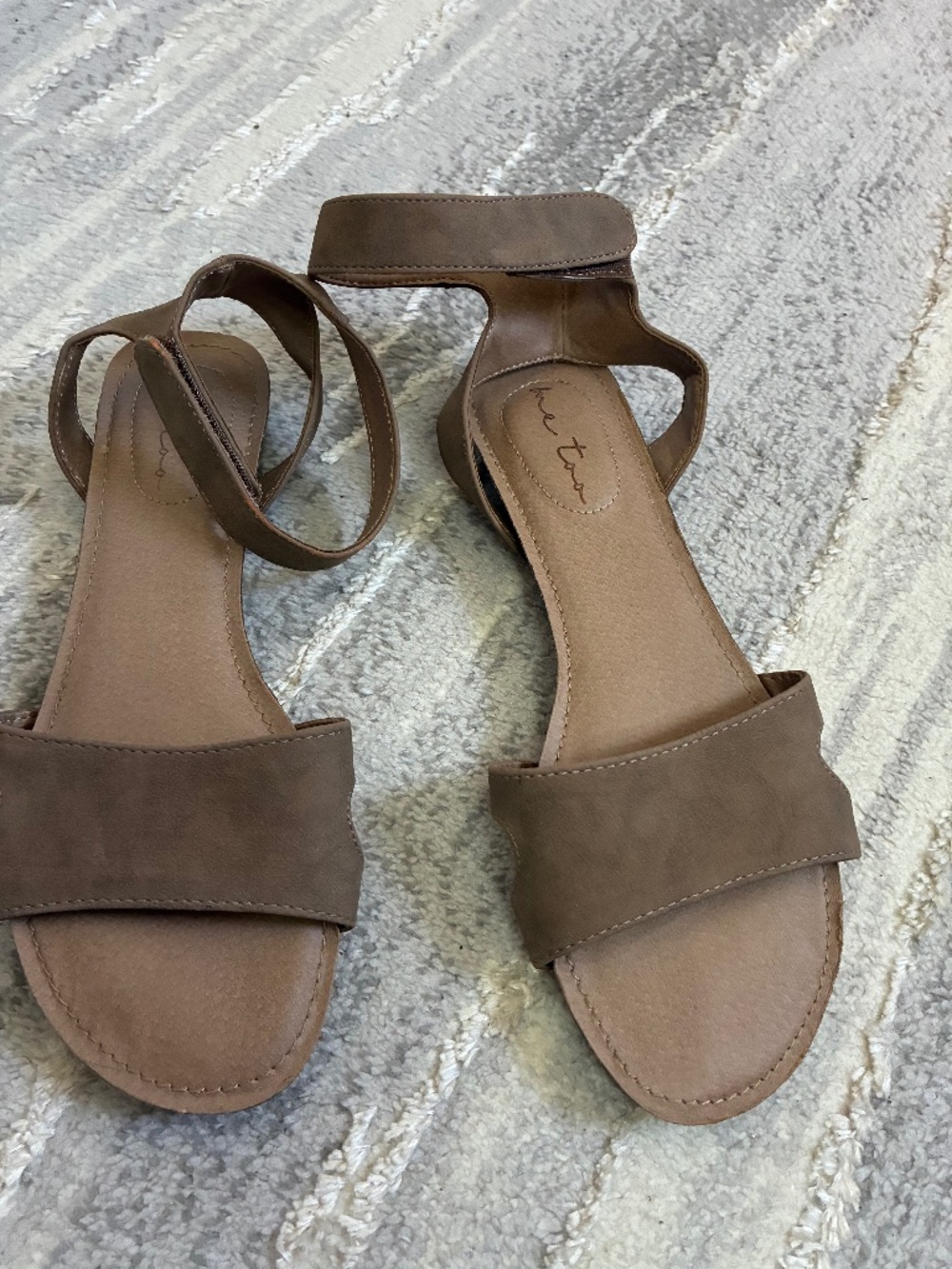 Me Too brand flat sandals in a taupe color, Ankle strap. Size 9